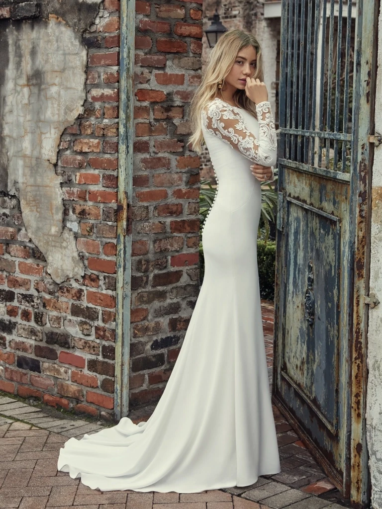 Bride wearing a long sleeve bridal gown