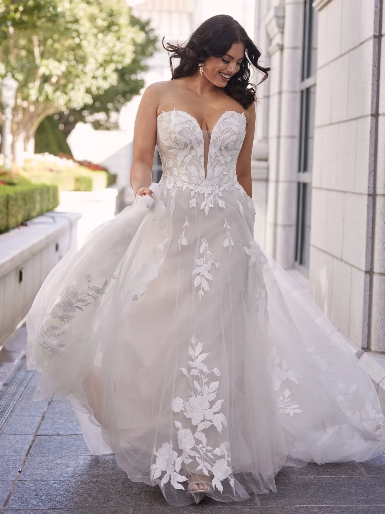 Model wearing strapless bridal gown