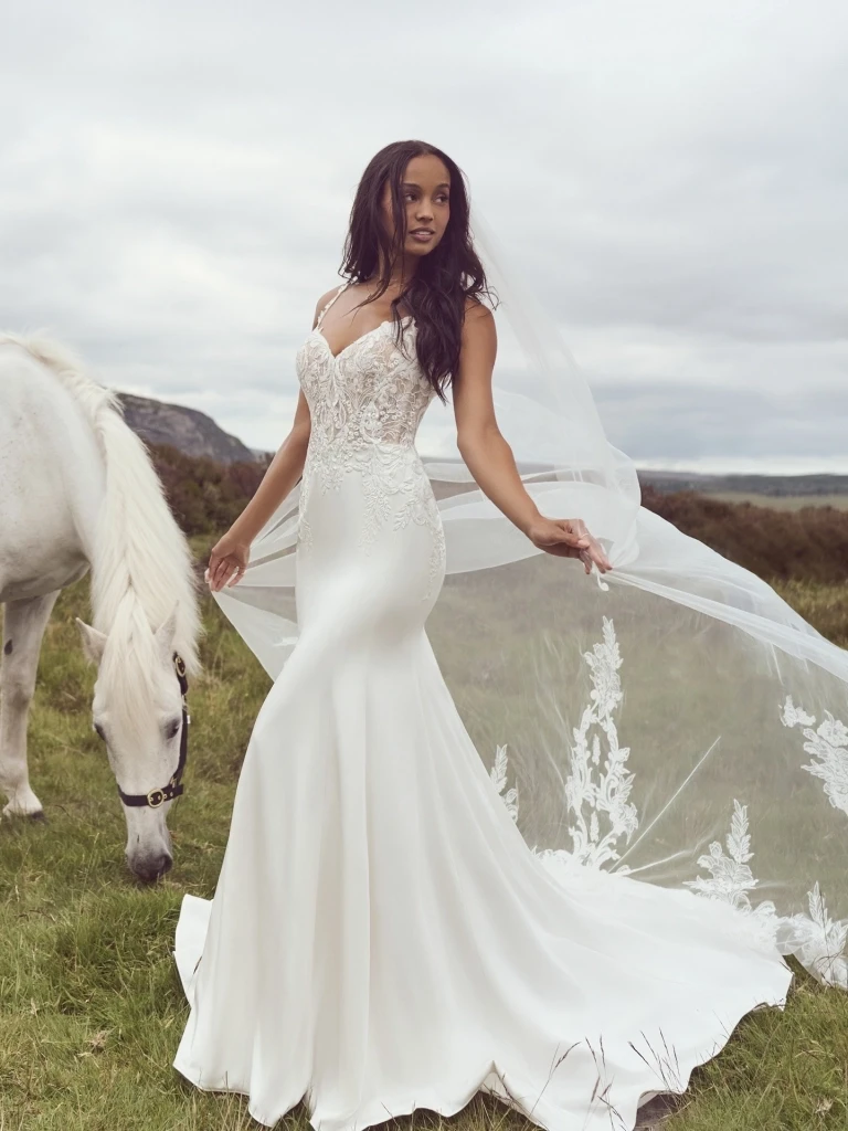 A model wearing a white bridal gown