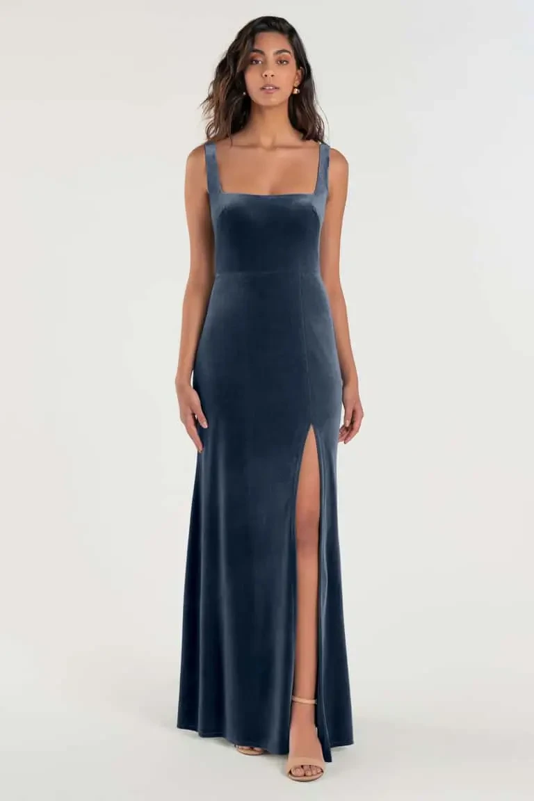 model is wearing a sleeveless velvet bridesmaid dress by jenny yoo