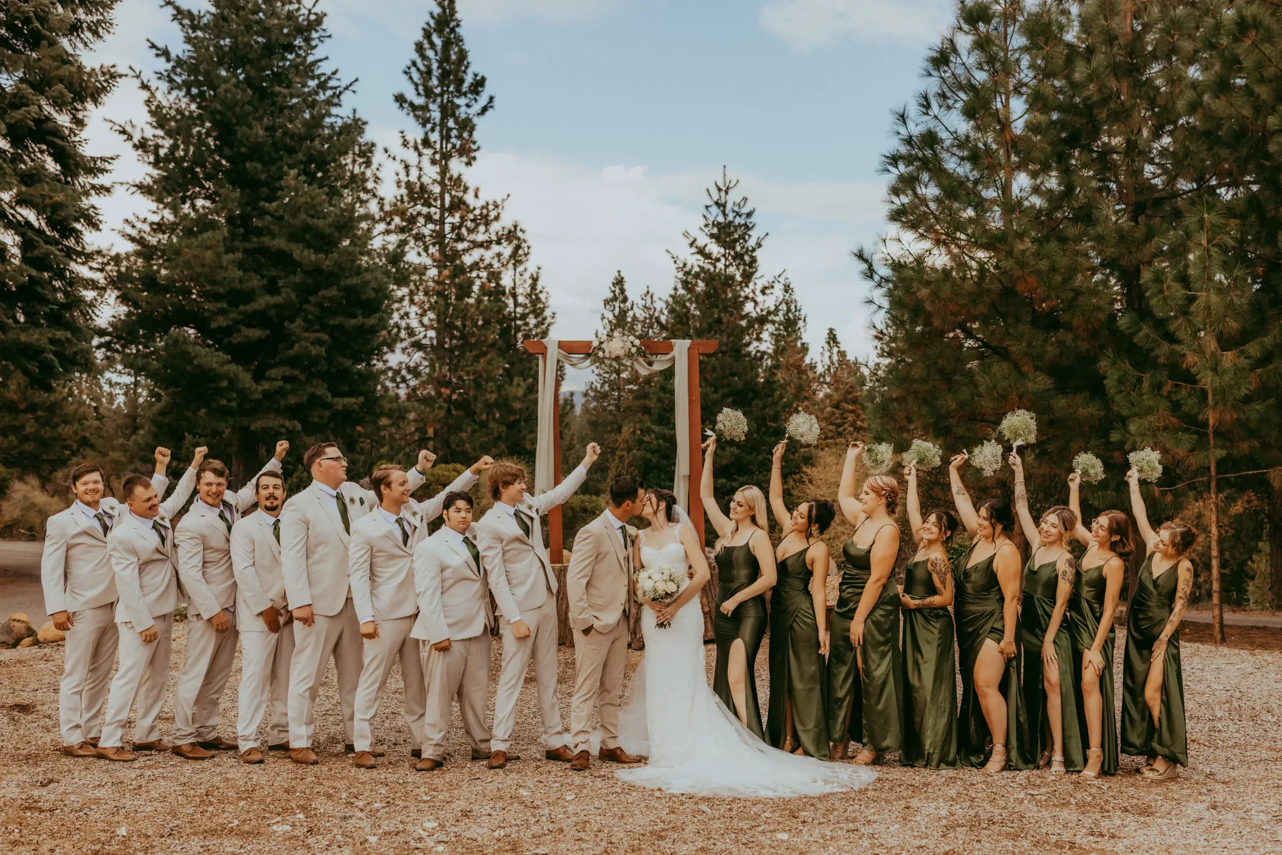 image shows bride, husband and full wedding party on their wedding day