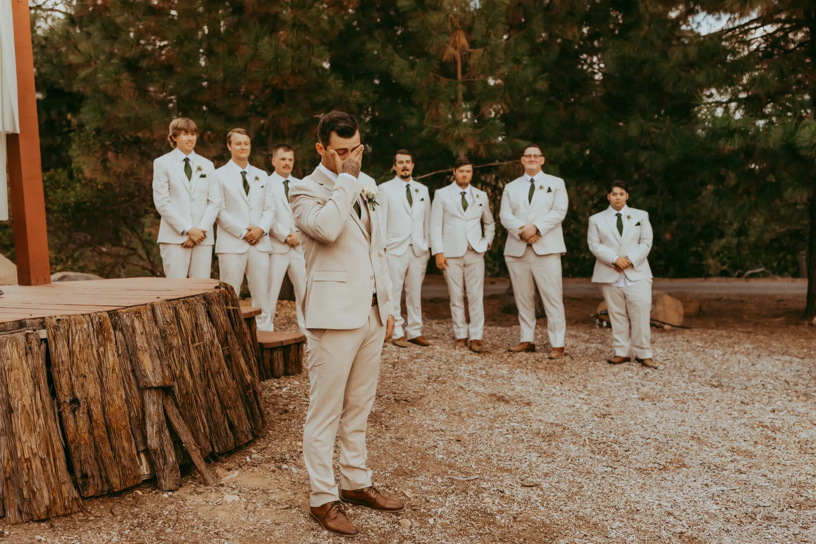 image shows husband waiting for wife at the end of the aisle