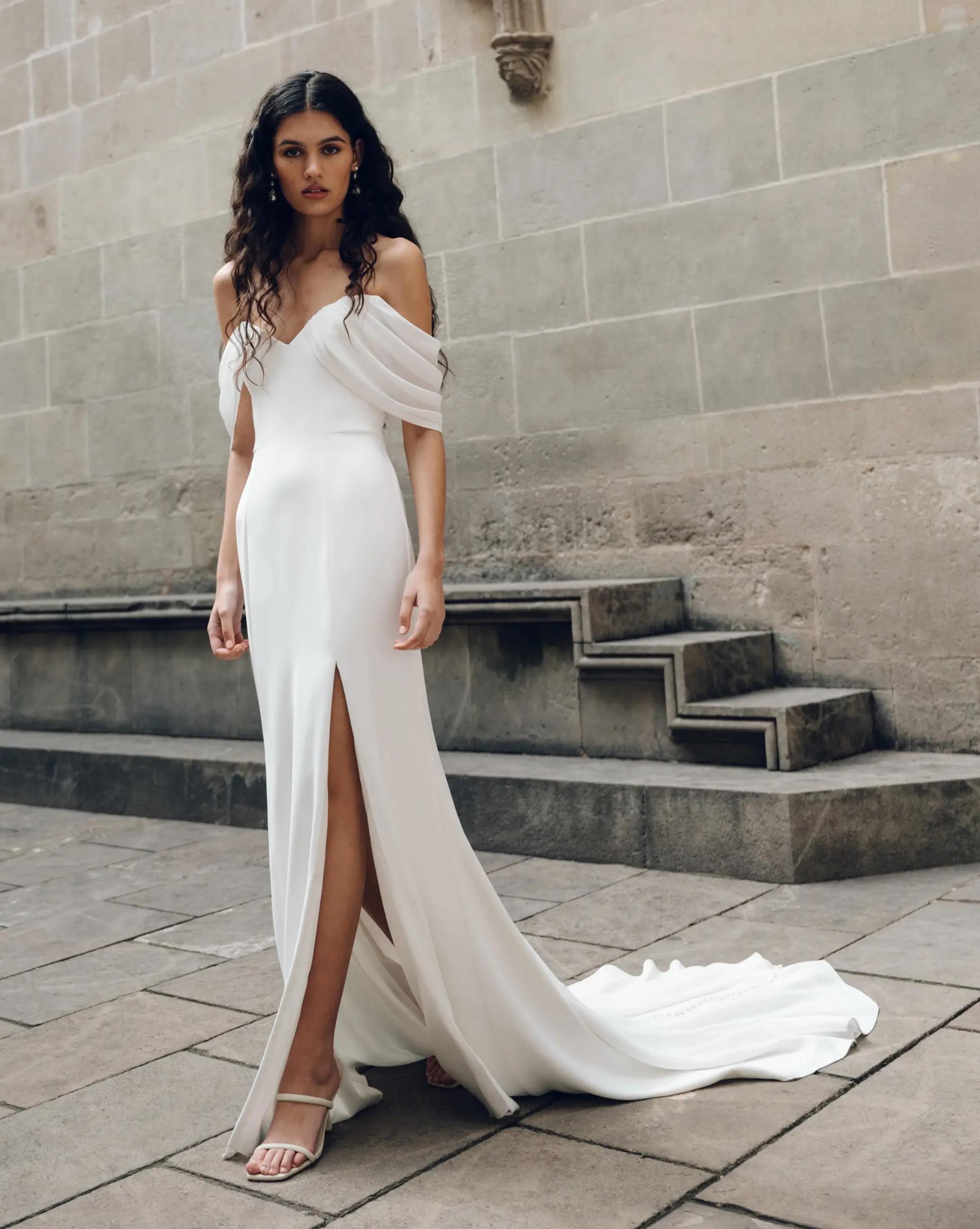 Model wearing a white gown by Jenny Yoo