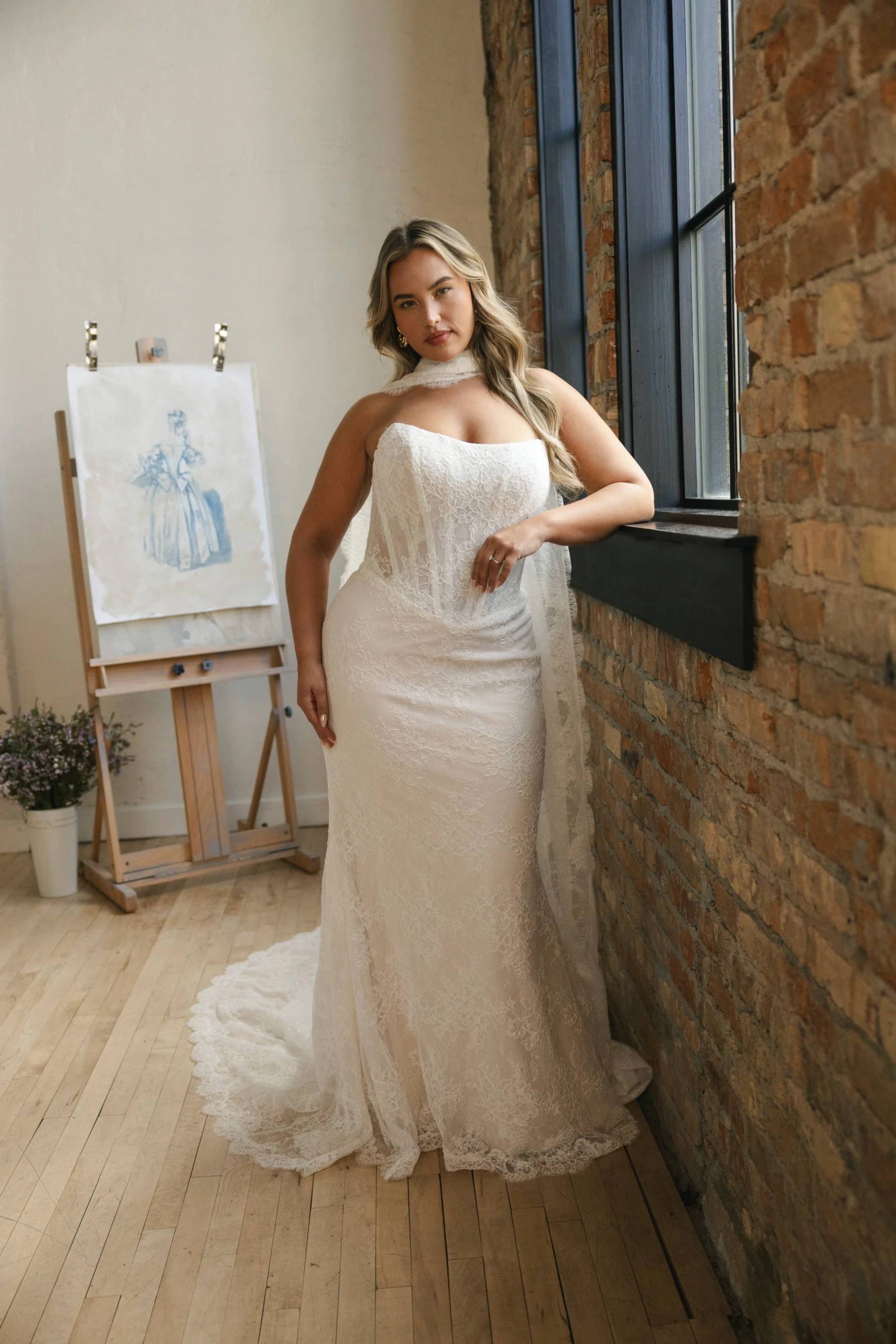Model wearing a white curvy dress
